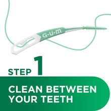 GUM SOFT-PICKS interdental brush step 1 to clean between teeth