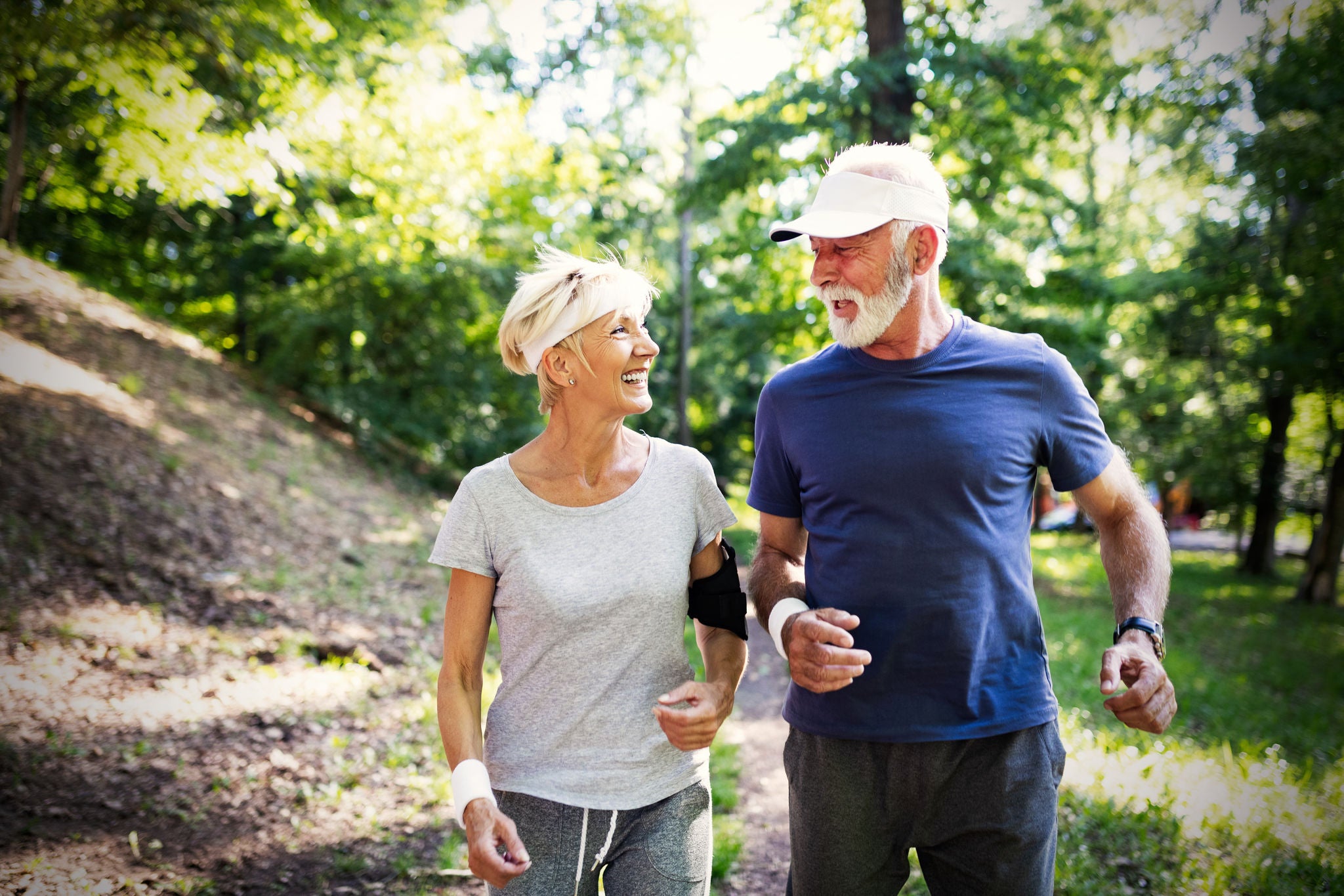 Beautiful sporty senior couple staying fit with running and jogging