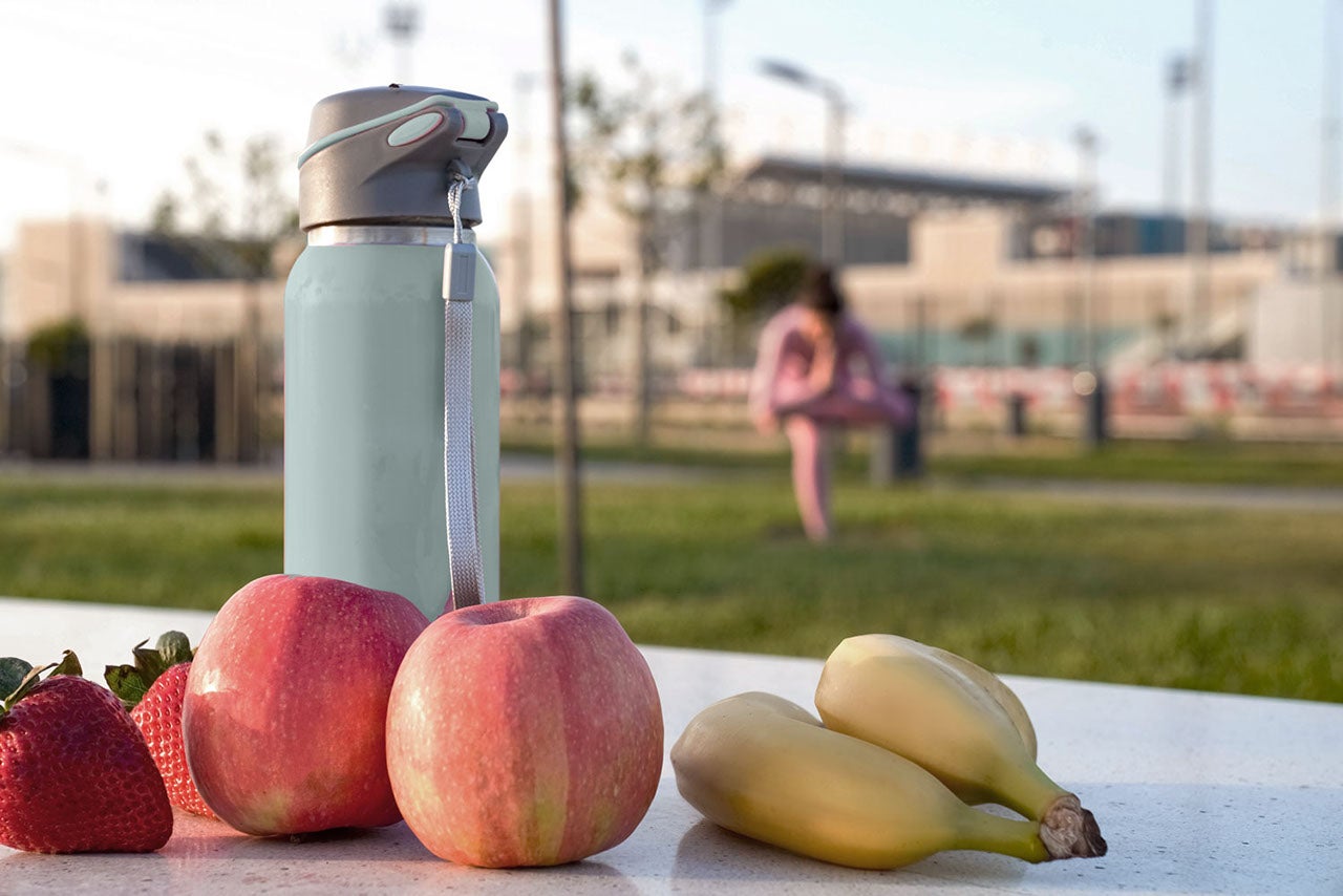 green-bottle-and-fruits-outdoor.jpg