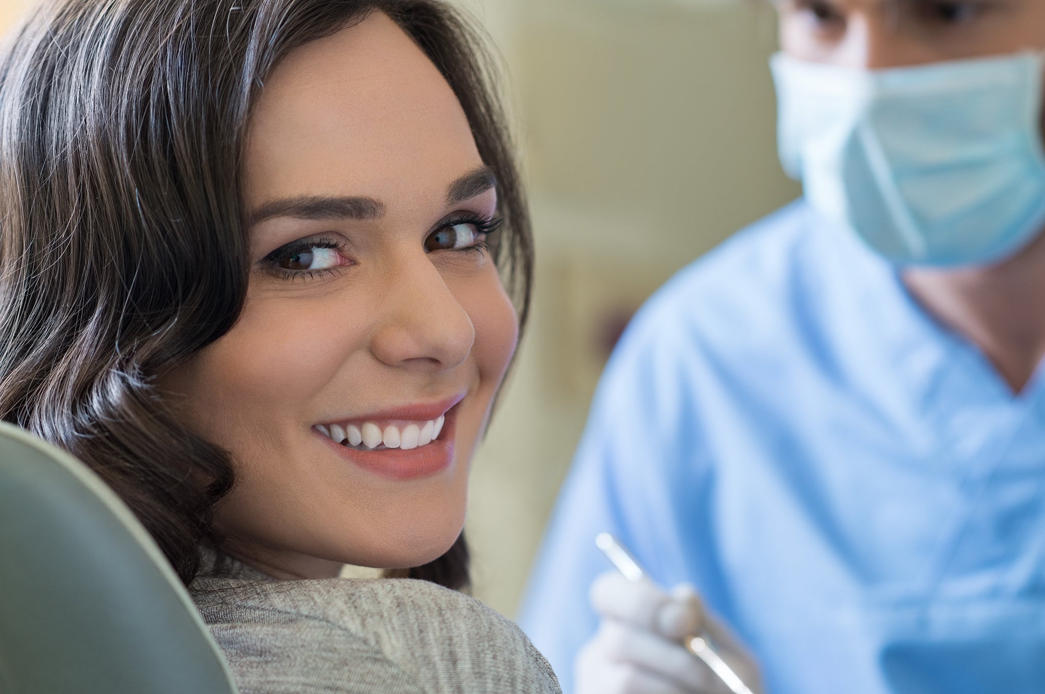 Smiling young woman at dentist office