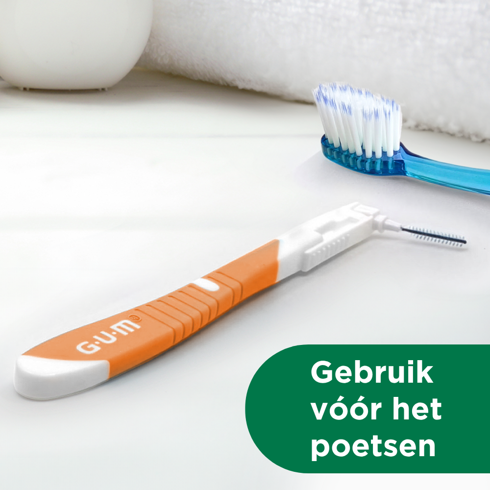 GUM BI-DIRECTION interdental brush shown flat with GUM PRO toothbrush