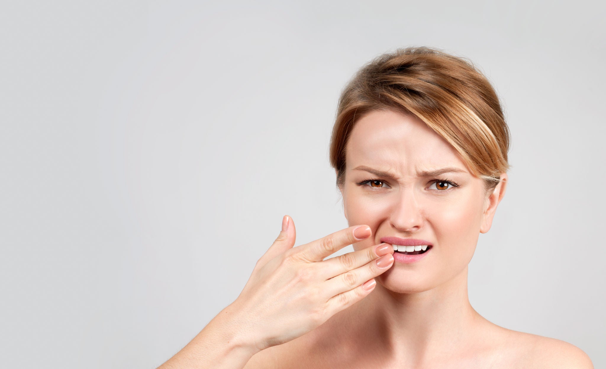 Tooth pain and dentistry, woman feeling strong toothache. 