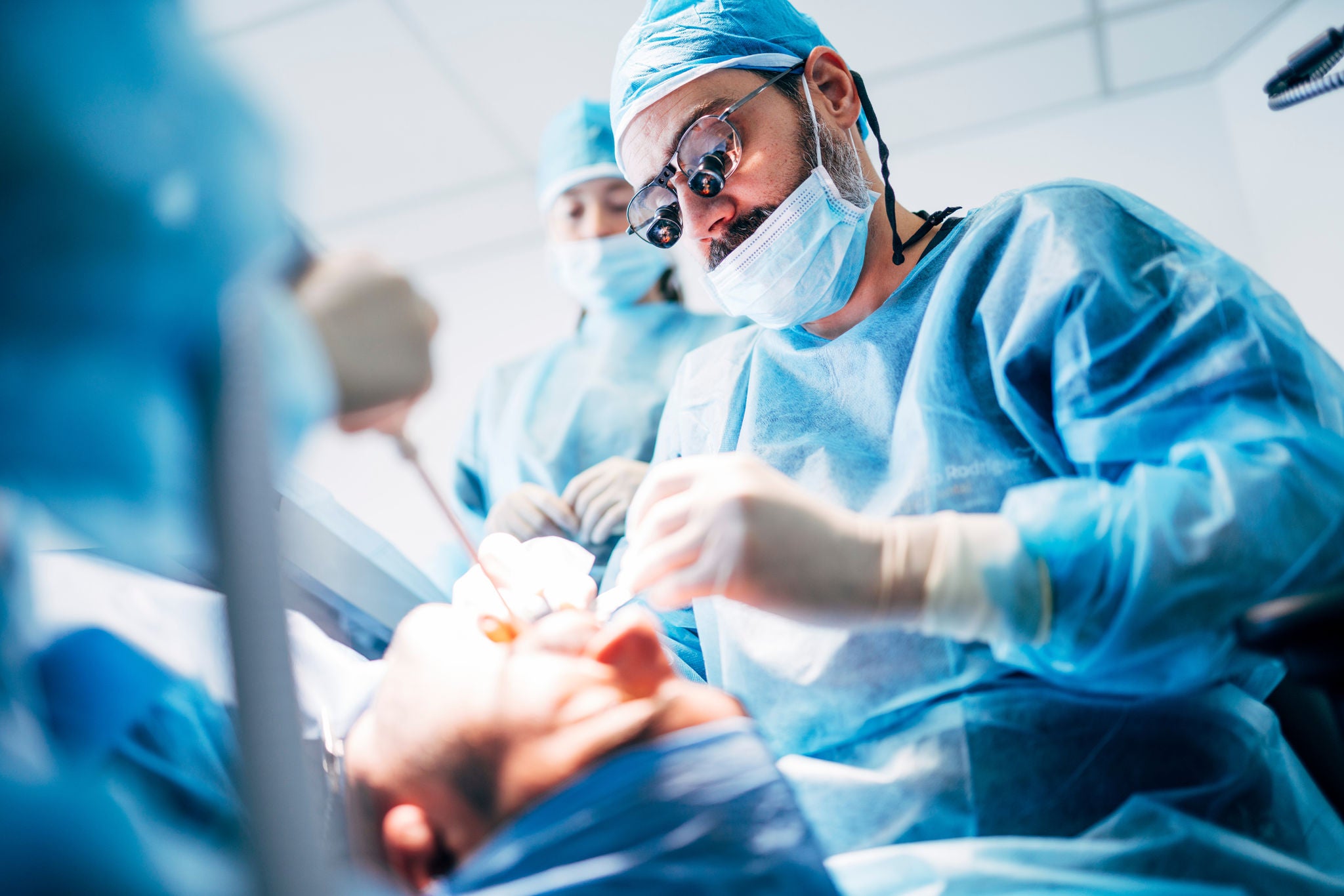 Team dental surgeons working in dental clinic.