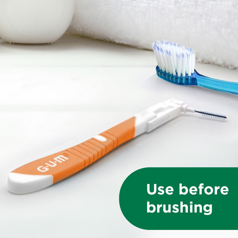 GUM BI-DIRECTION interdental brush shown flat with GUM PRO toothbrush