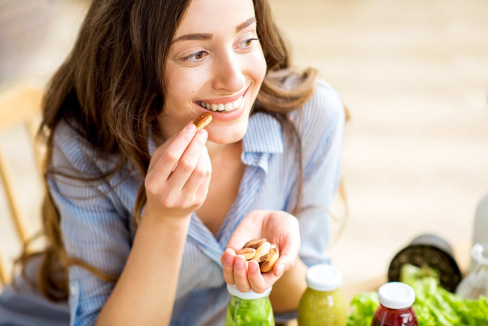 Woman female eating nuts healthy
