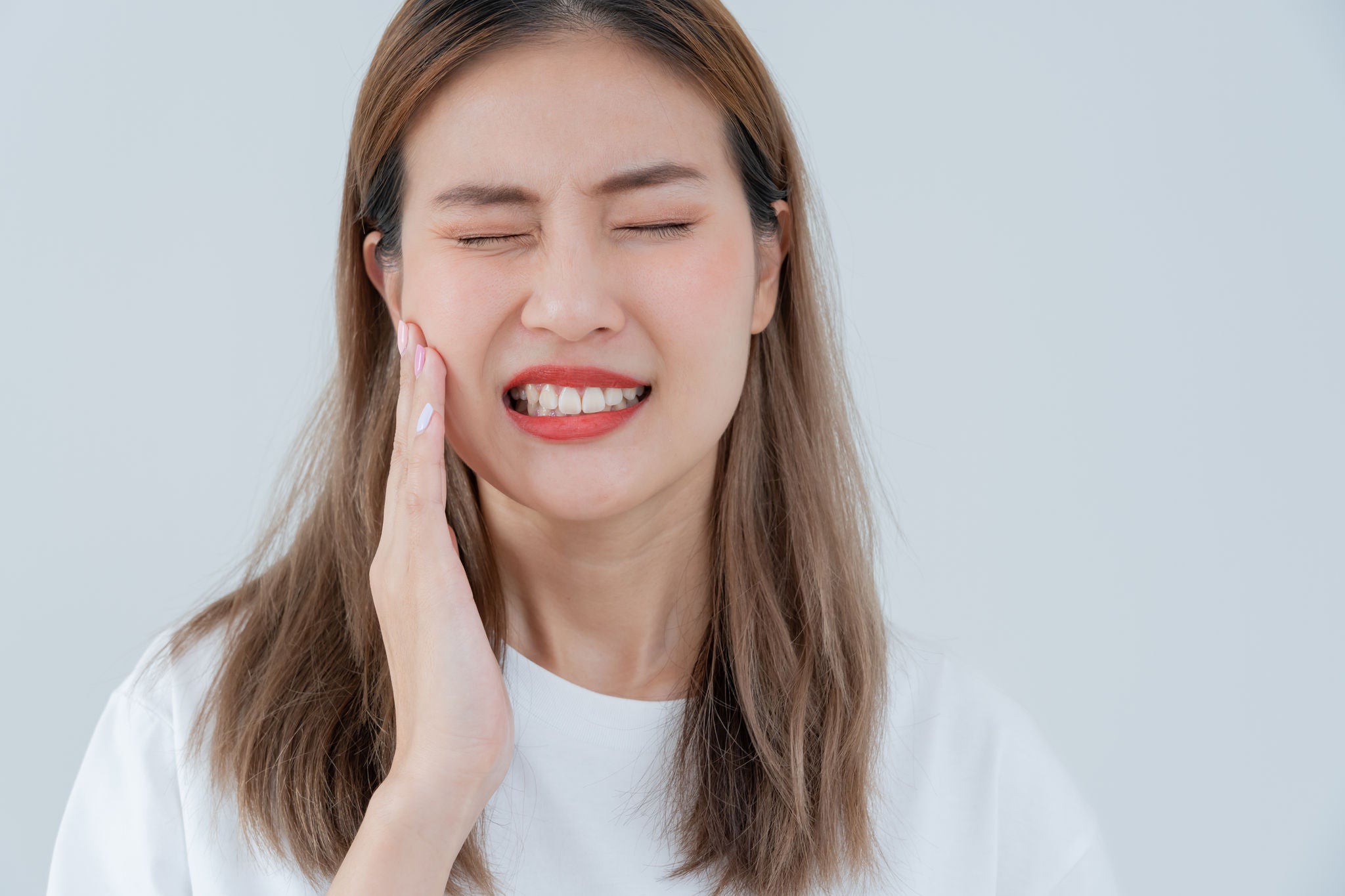 Asian-woman-suffering-from-gingivitis-and-receding-gums