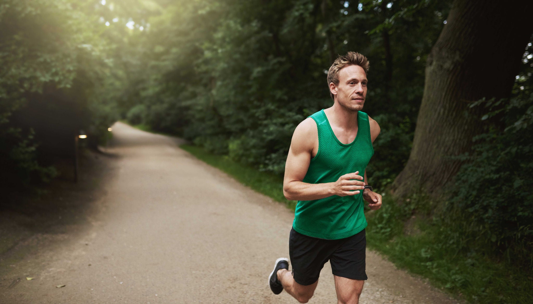 Athletic Man Running at the Park