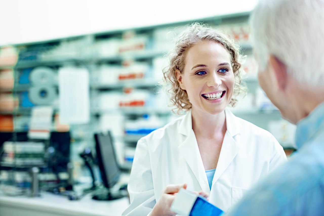 Female woman pharmacist assisting a senior customer  iStock-629514140