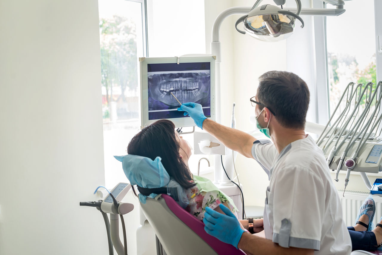 OCP-Dentist-blue-mask-treating-woman